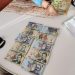 Cum arată valizele și gălețile pline cu BANI, găsite în urma perchezițiilor DNA în cazul ”fabricii de permise” de la Suceava | 1,2 milioane de euro au fost găsiți