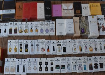 Parfumuri, produse cosmetice și articole vestimentare contrafăcute, confiscate în Piața 100