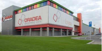 Milionarul care a vândut la sfert de preț  mall-ul Oradea Shopping City firmei la care  e acționar Lotus Center, construiește un cartier rezidențial cu turnuri de 18 etaje